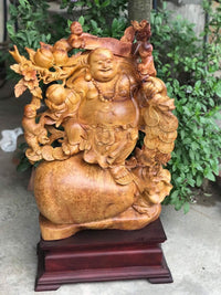 Tượng Di Lặc Vác Cành Đào Nu Hương