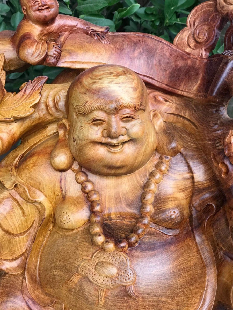 Tượng Di Lặc Vác Cành Đào Nu Hương