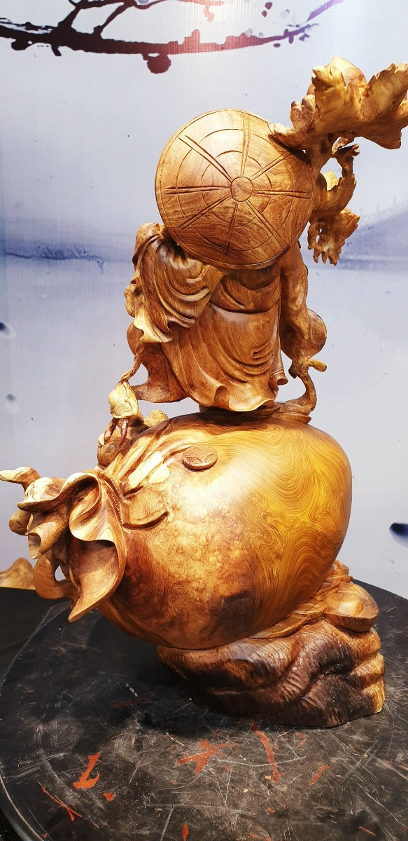 Tượng Di Lặc Vác Cành Đào Nu Hương